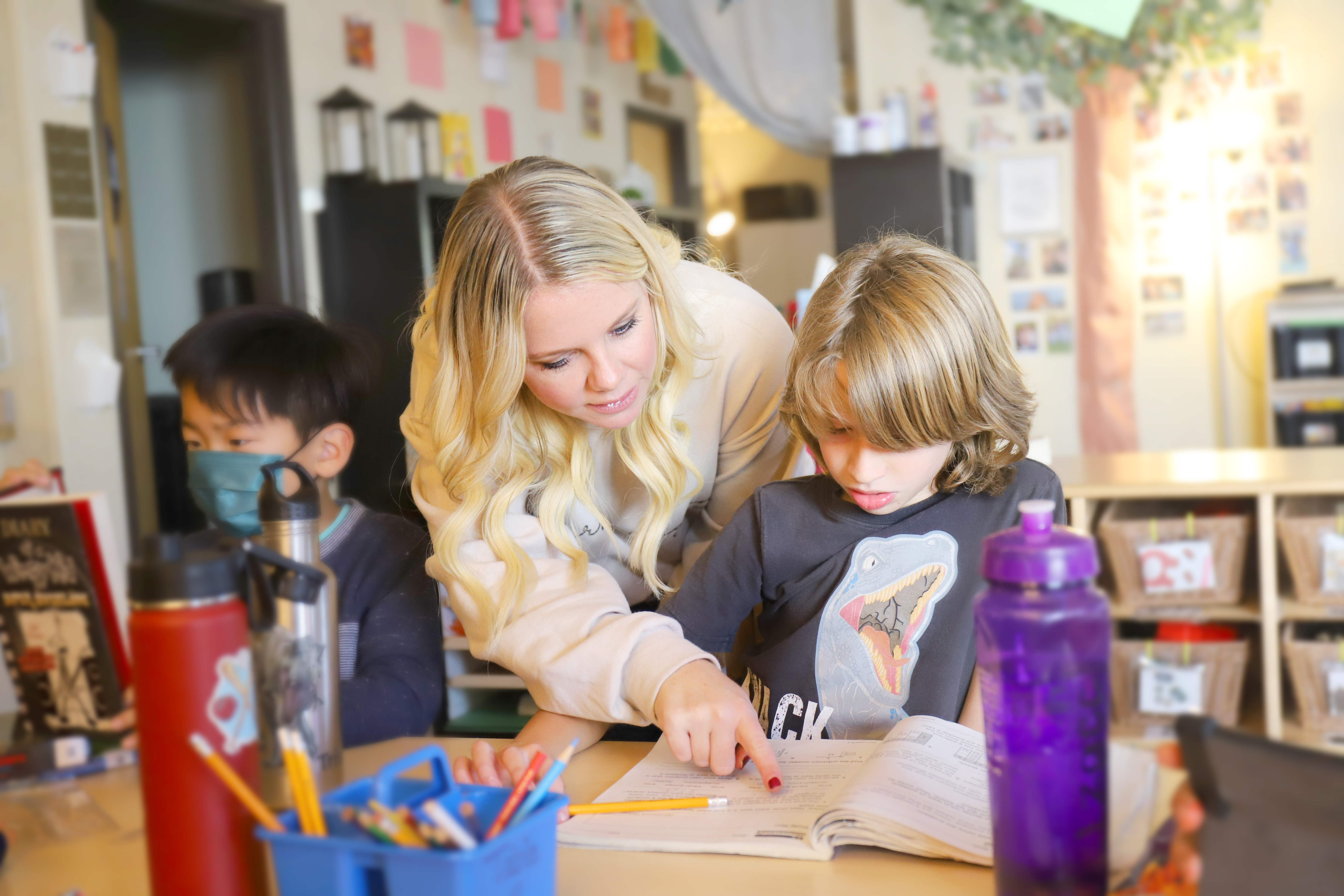 Adult and child looking at a book together
