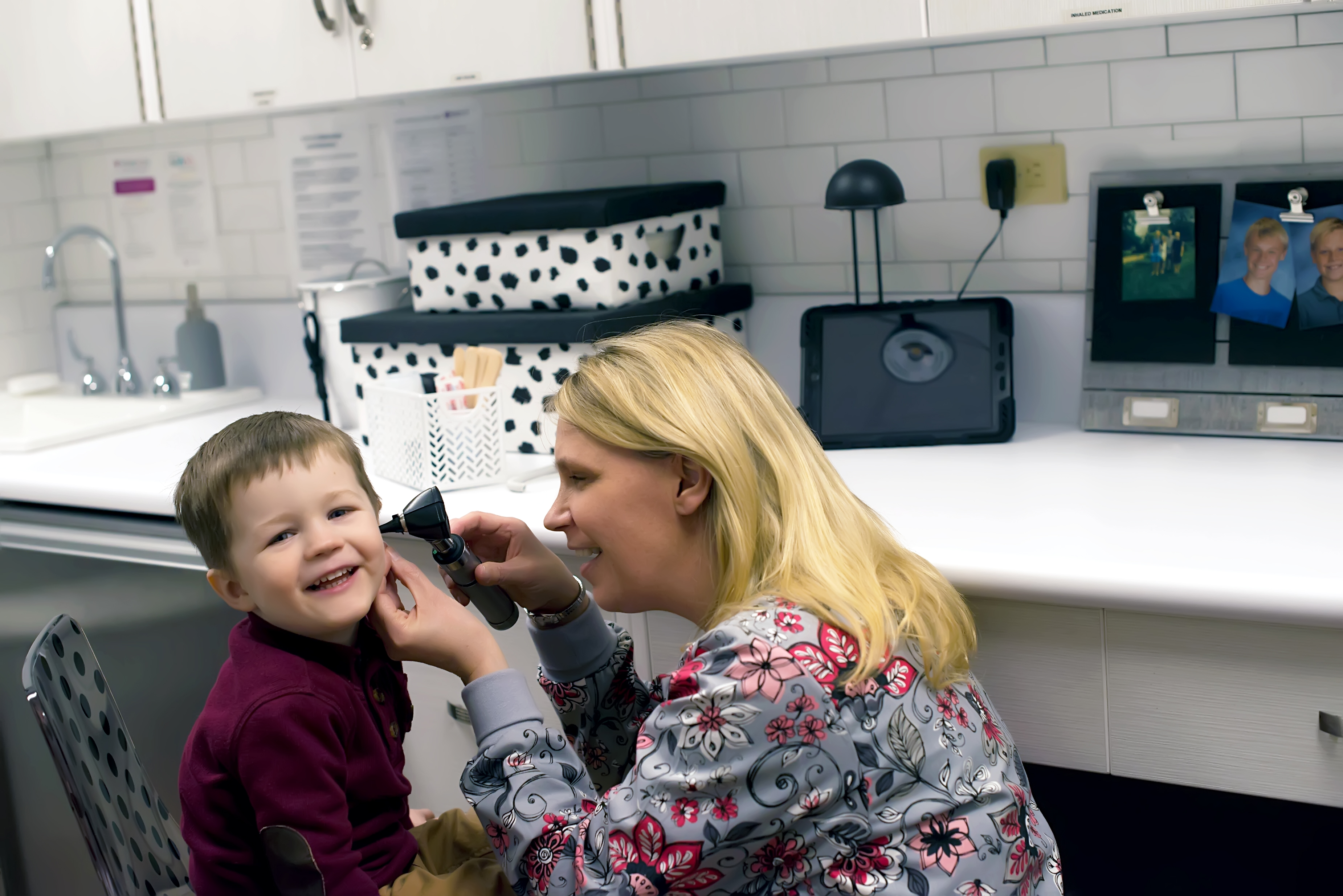 Person examining a child's ear