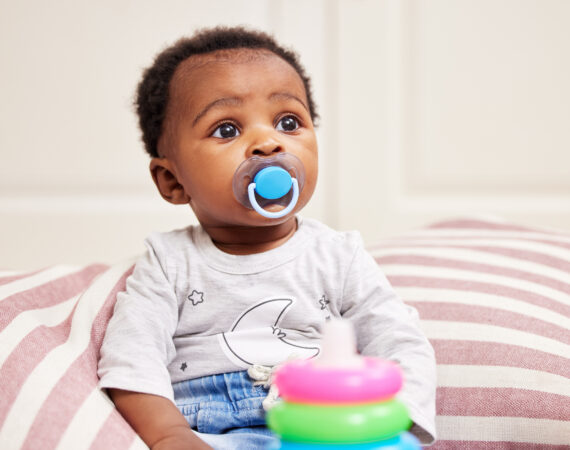 Child with a pacifier in their mouth