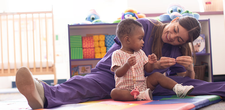 Adult and child playing together on the floor