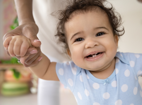 Child holding an adult's hand