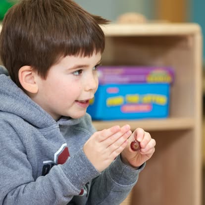 Child holding a small object