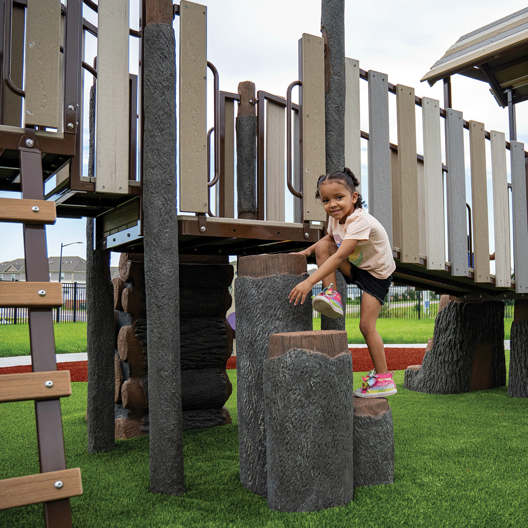 Child climbing on playground equipment