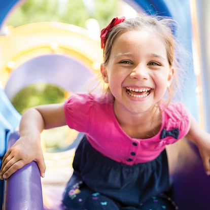 Child on a playground slide
