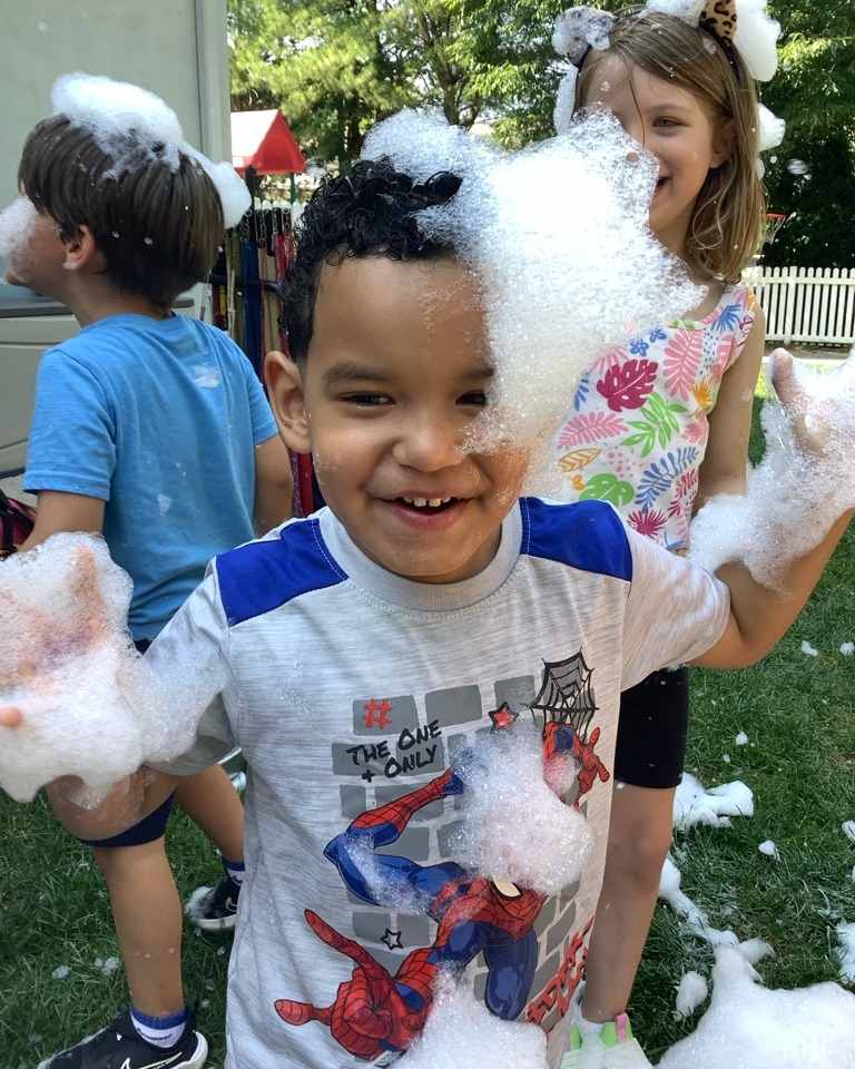 Children playing in foam