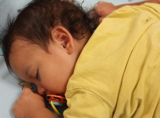Child sleeping with a pacifier