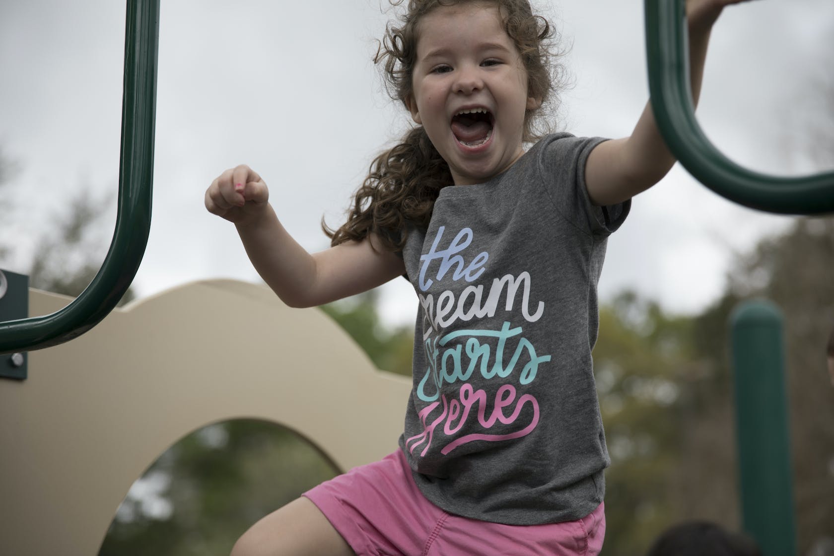 Child on playground equipment