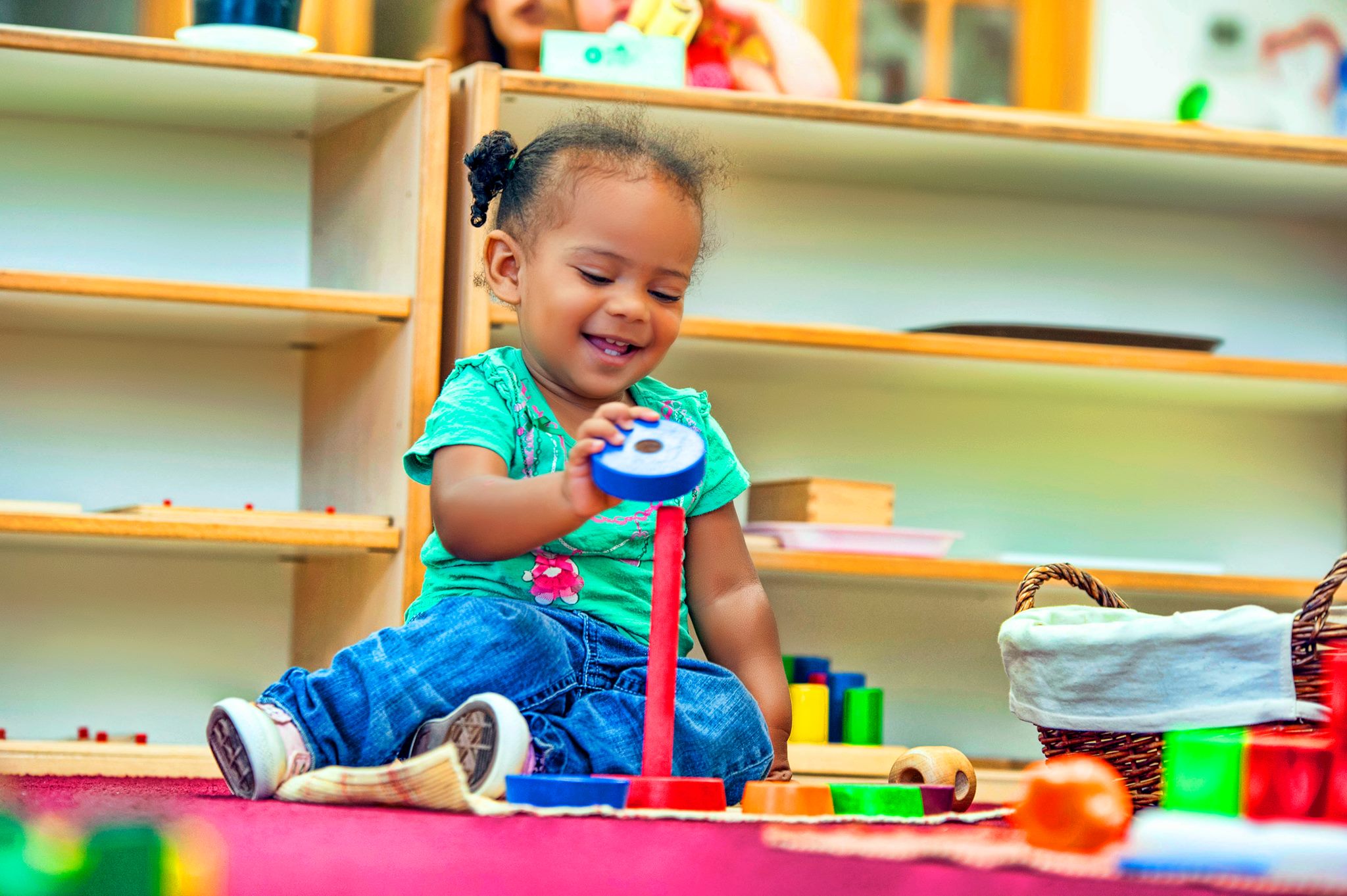 Child playing with a stacking toy