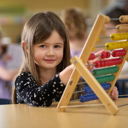 Child using an abacus