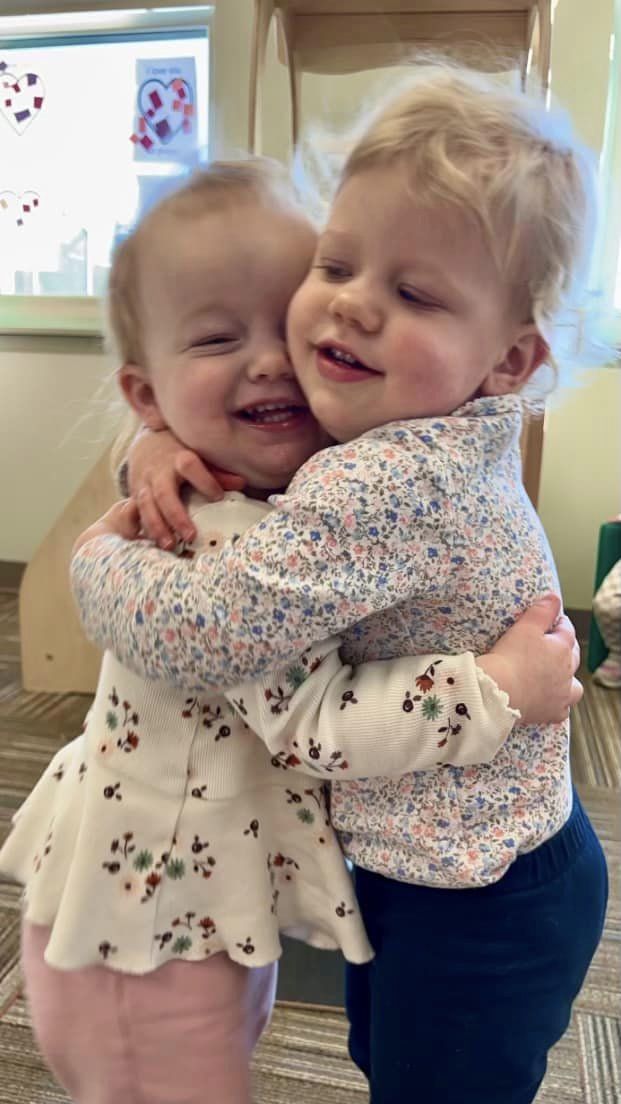 Two children hugging