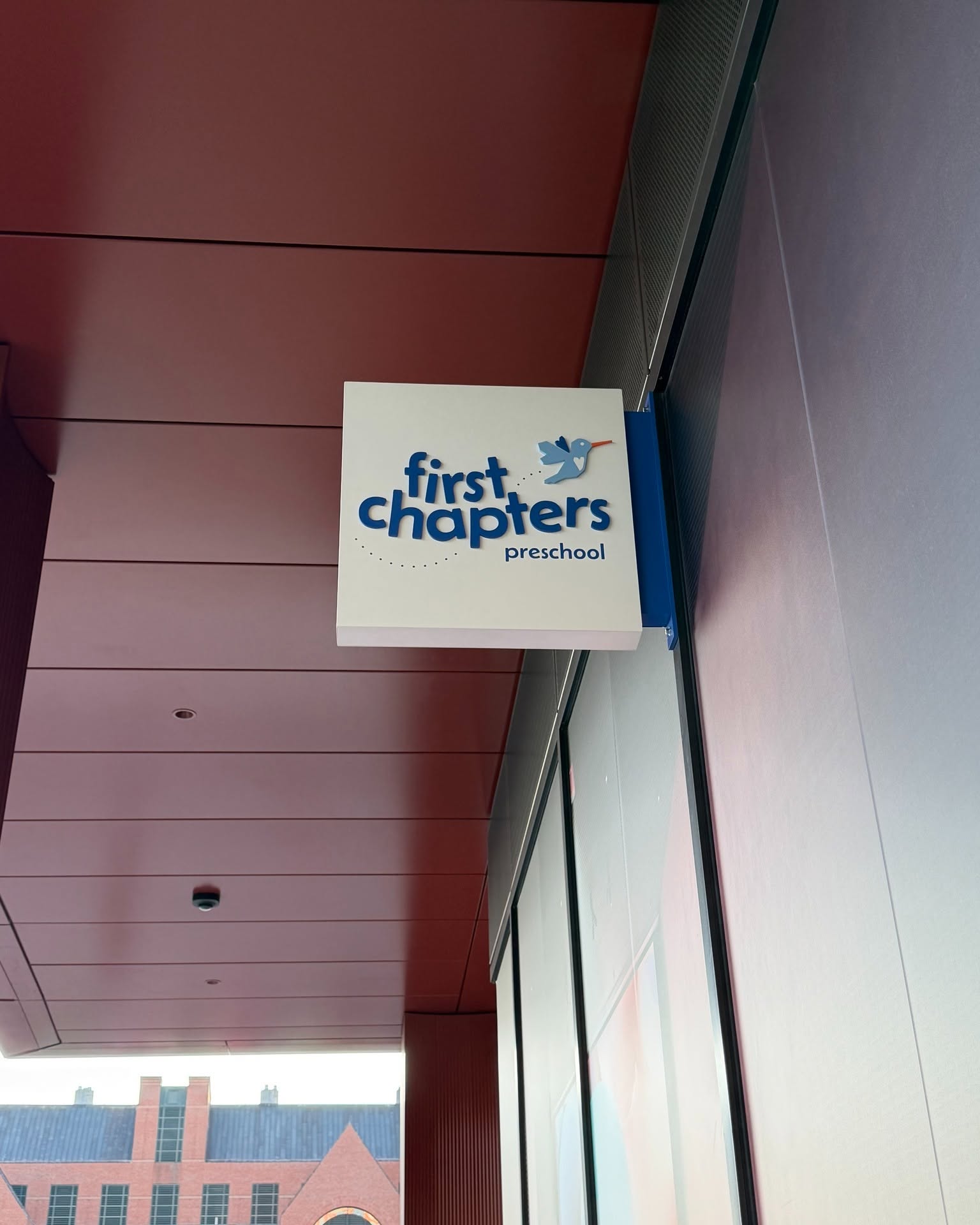 First Chapters Preschool sign mounted on a building exterior