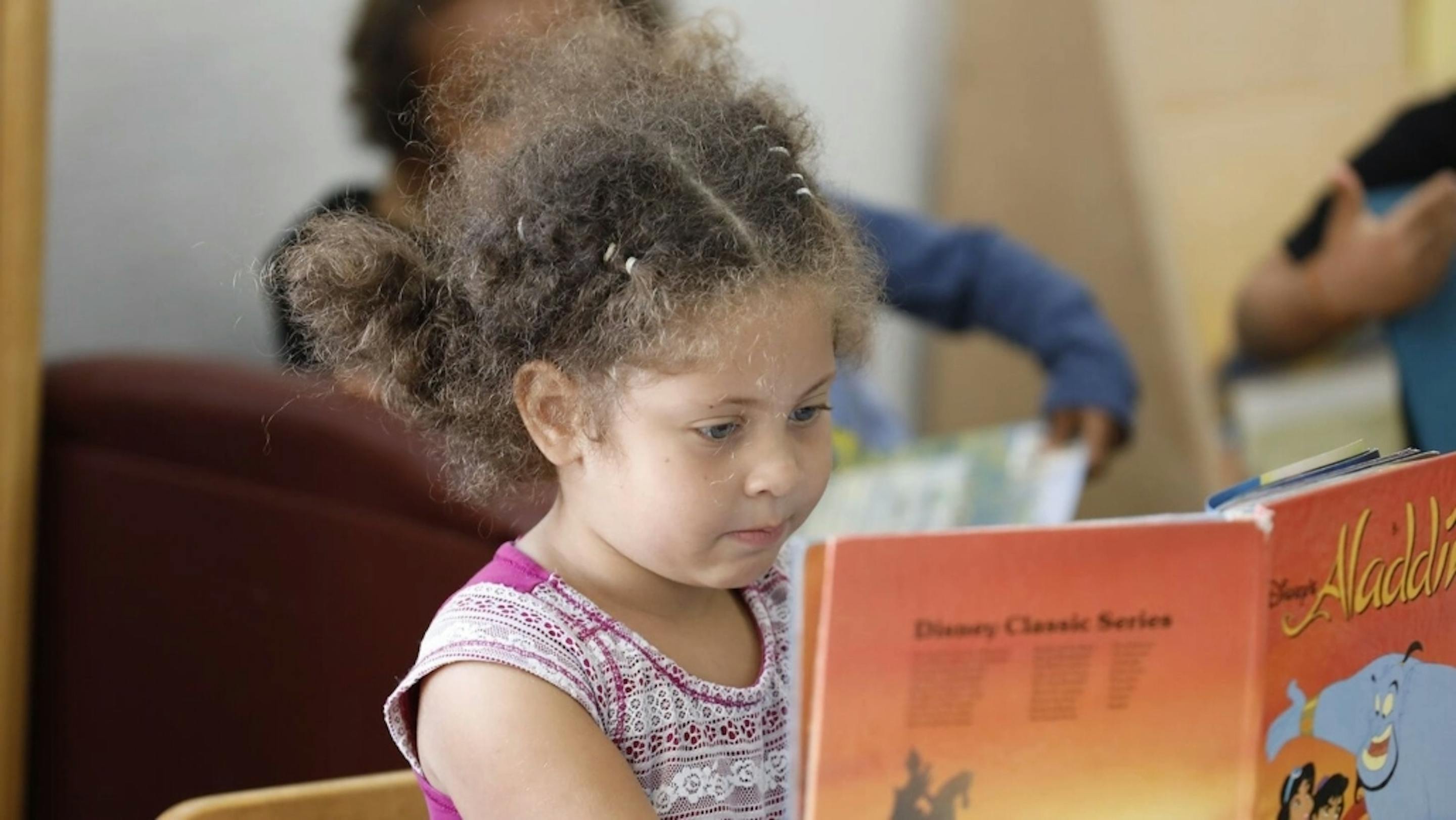 Child reading a book