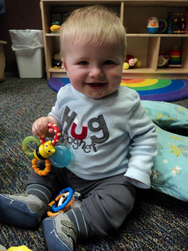 Child holding a toy bee