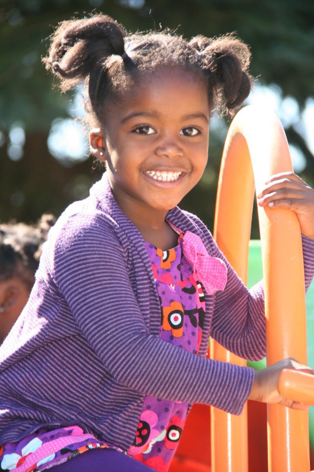 Child smiling on a playground
