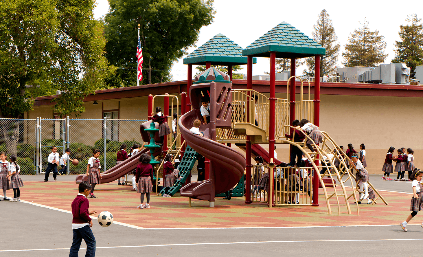Children playing on a playground structure