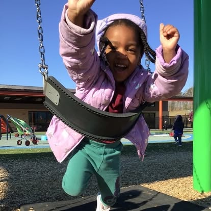 Child on a swing at a playground