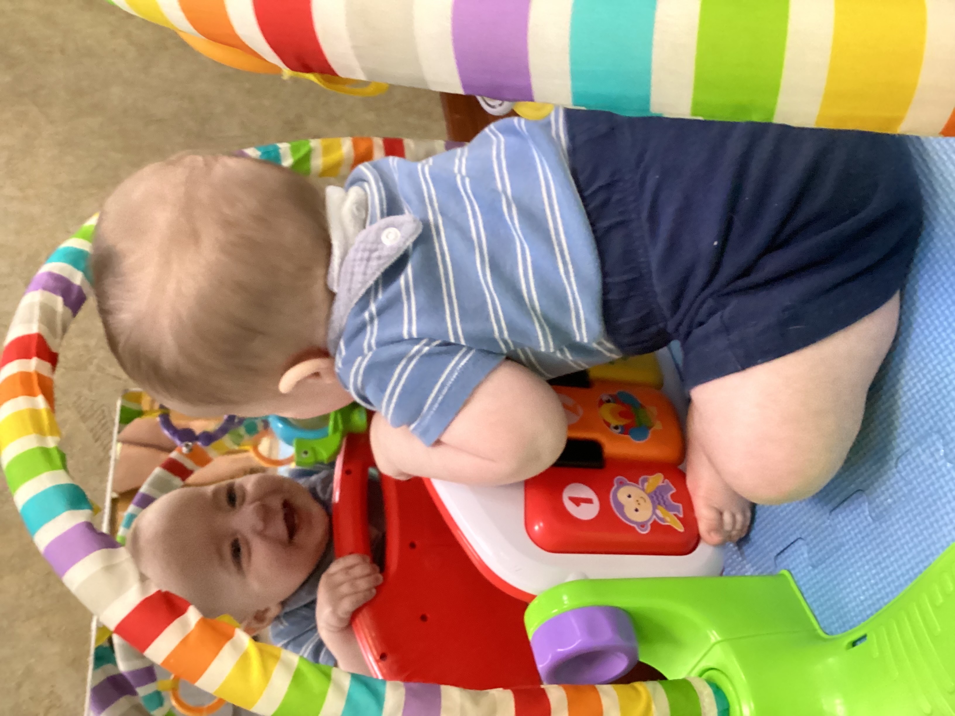 Child playing with a colorful toy