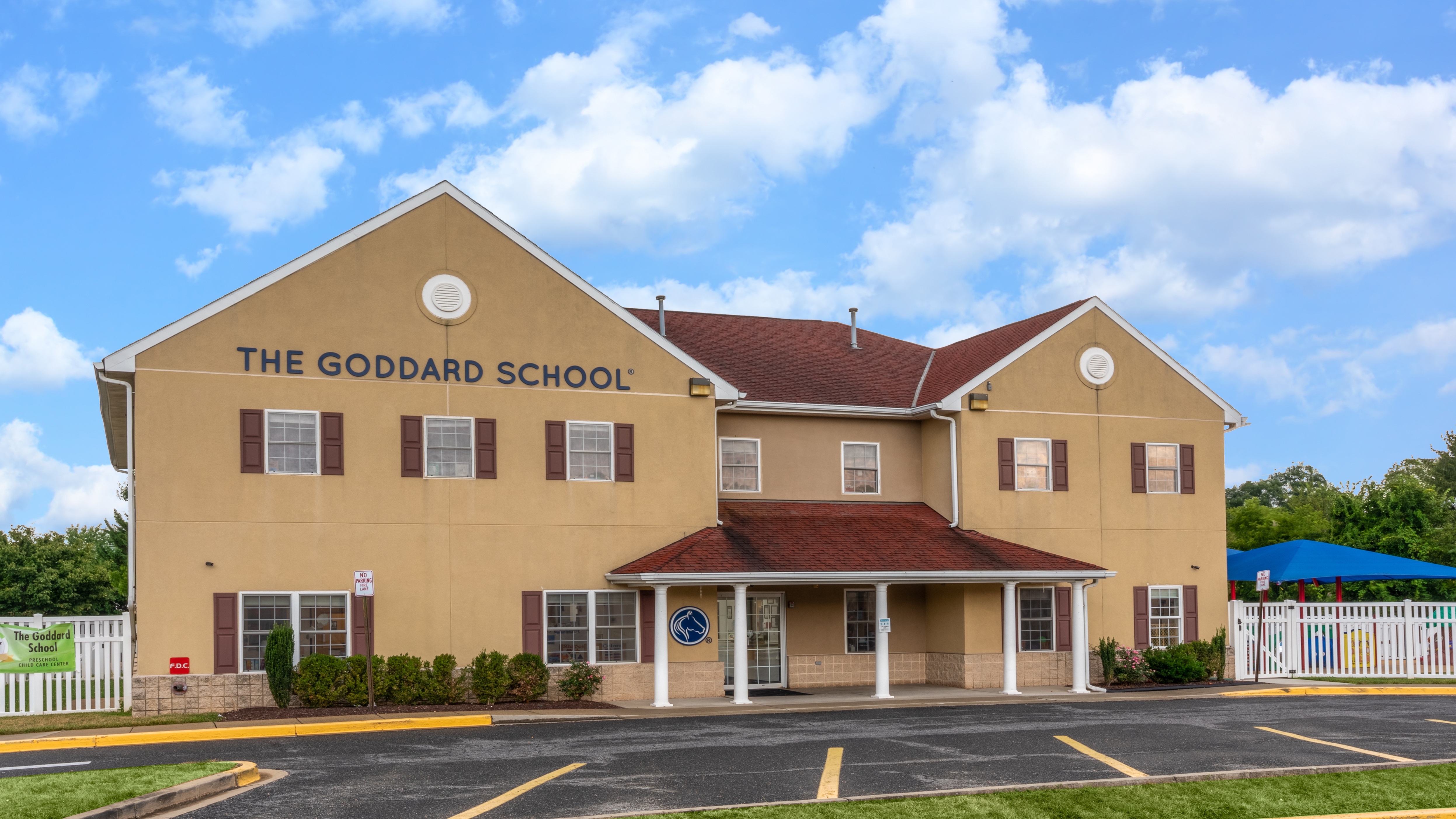 The Goddard School building with "THE GODDARD SCHOOL" on its facade