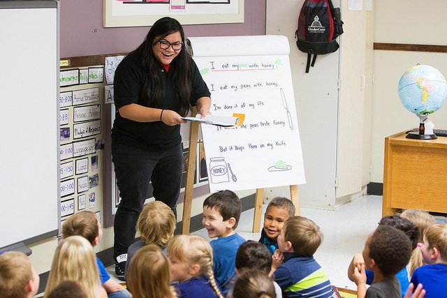 Person teaching children in a classroom