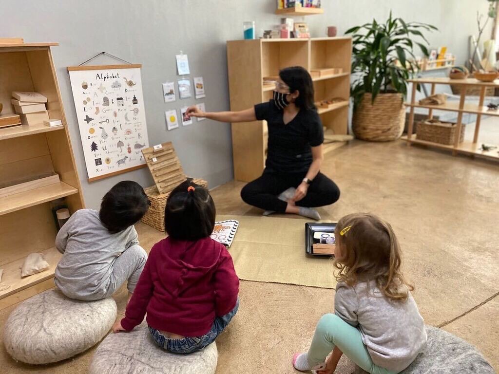 Person teaching children in a classroom